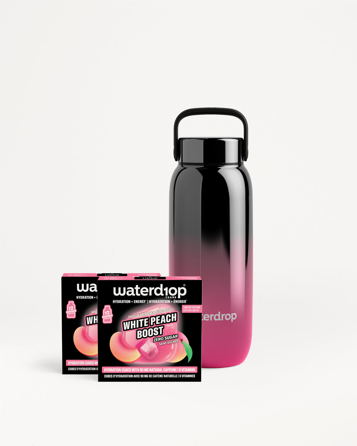 Višekratna boca s gradijentom crna u ružičasta pored dvije kutije Waterdrop.