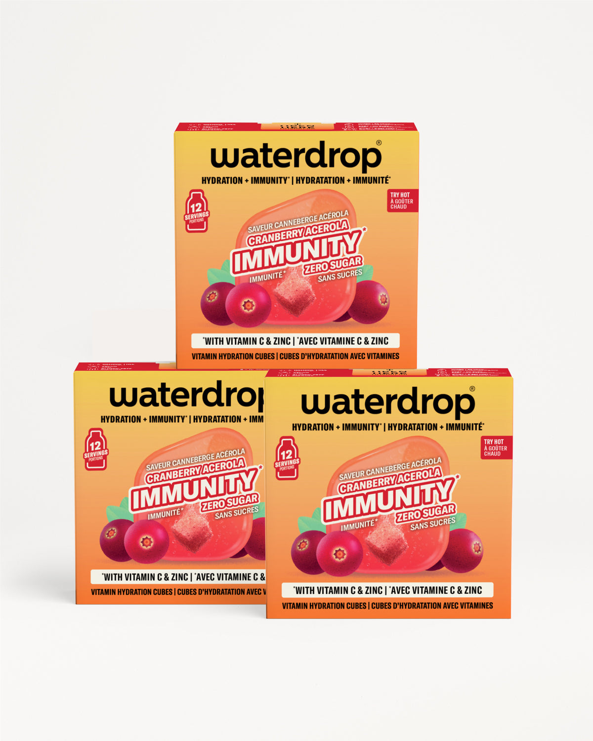 Tri kutija Waterdrop imunostituta narančasto-žute boje složene zajedno s grafikom bobica.