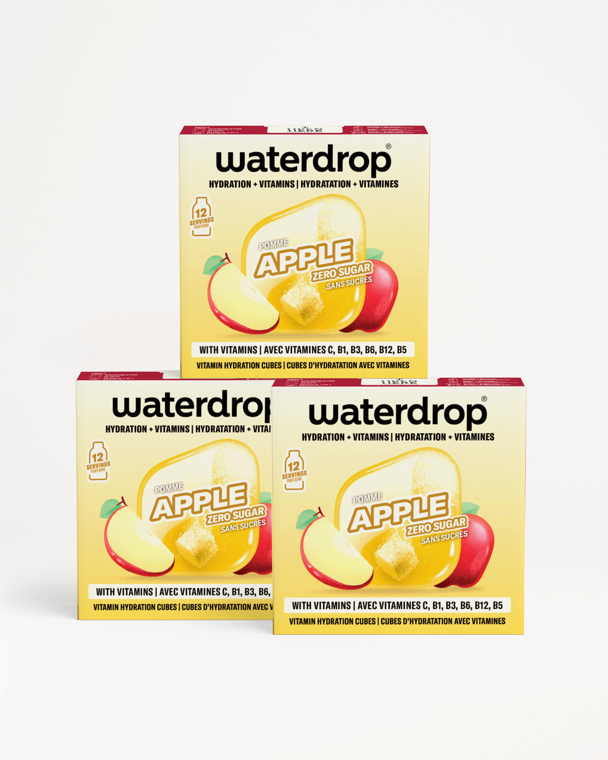 Tri kutije Waterdrop jabuka hidratacijske vitaminske kapi poredane u piramidu.