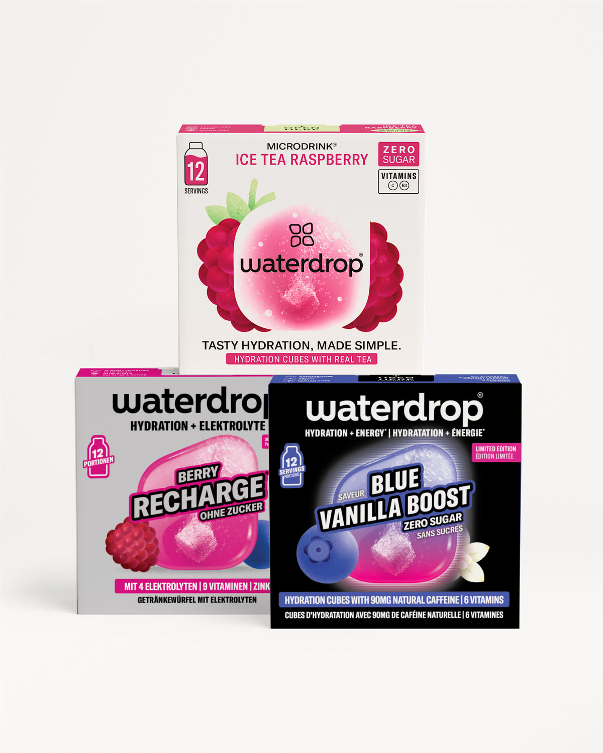 Tri kutije Waterdrop hidratacije složene u piramidu s ružičastom, ljubičastom i plavom grafikom pakovanja.